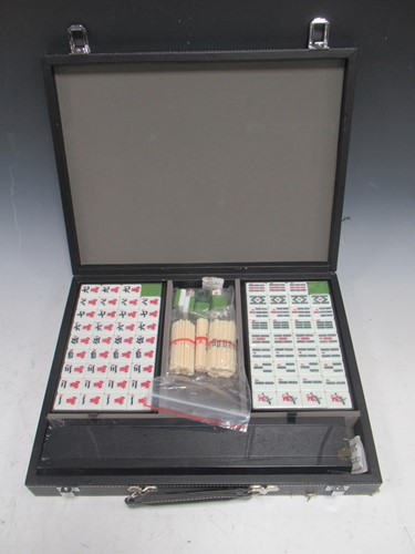 Lot 17 - A cased mahjong set, still sealed and unopened...