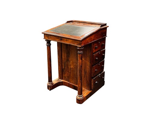Lot 609 - An early 19th century rosewood Davenport, the...