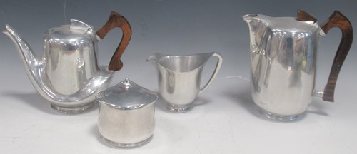 Lot 22 - Picquot ware, a four-piece stainless steel tea...