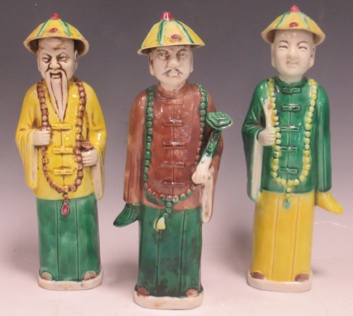 Lot 14 - Three ceramic Chinese standing figures in...