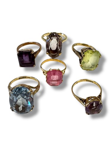 Lot 321 - Six gemset rings, to include two synthetic...