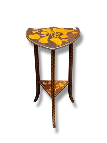 Lot 657 - A poker work shield shaped table dated 1902,...