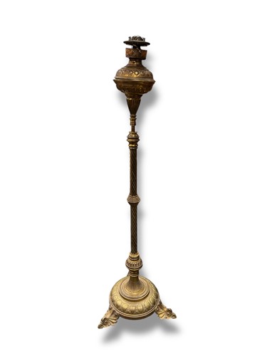 Lot 643 - A Victorian brass oil lamp with wrythen column,...