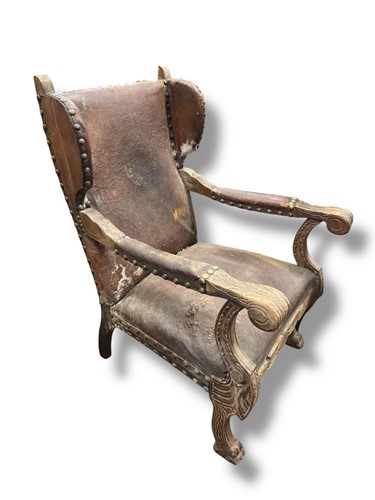 Lot 642 - A pair of leather distressed wingback...