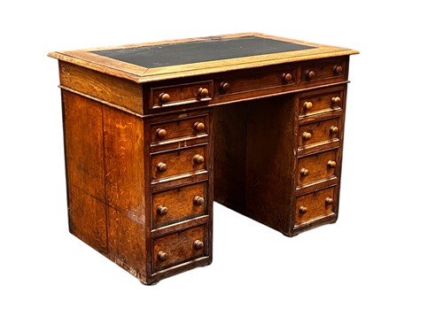 Lot 542 - An oak pedestal desk, circa 1900, comprising...