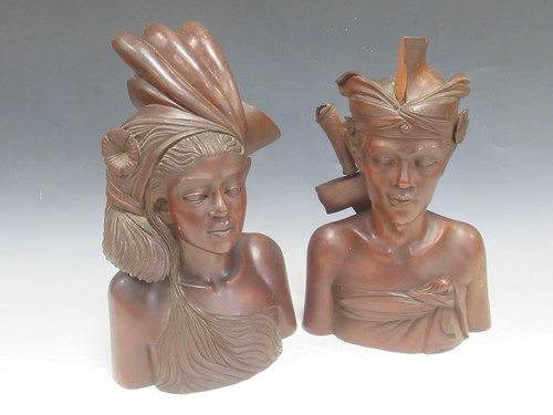Lot 131 - A pair of mid 20th century Malayan carved wood...