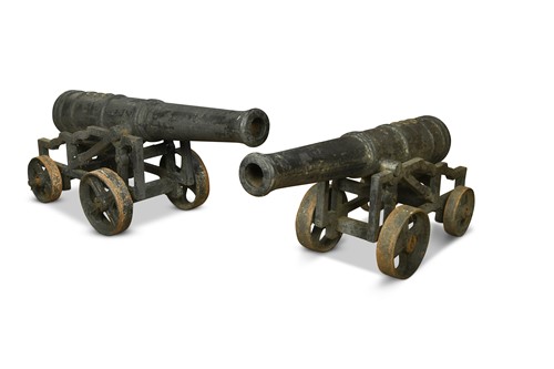 Lot 497 - A pair of decorative cast-iron cannons