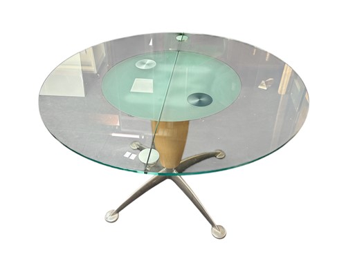 Lot 510 - A modern glass and chrome extending dining...