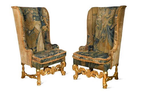 Lot 274 - A pair of Carolean-style carved giltwood wing back armchairs, 19th/20th century