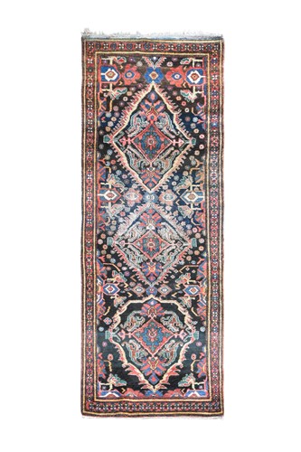 Lot 360 - A Hamadan triple-medallion runner rug, circa 1950