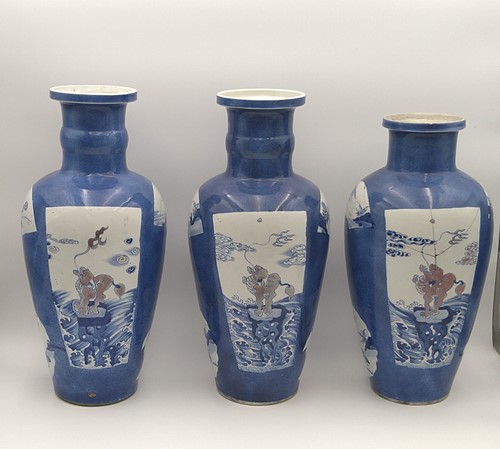 Lot 28 - A garniture of three Chinese powder blue ground vases, Qing Dynasty, 18th/19th century