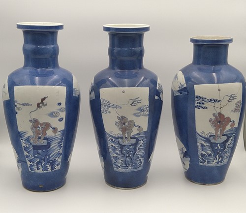 Lot 28 - A garniture of three Chinese powder blue ground vases, Qing Dynasty, 18th/19th century
