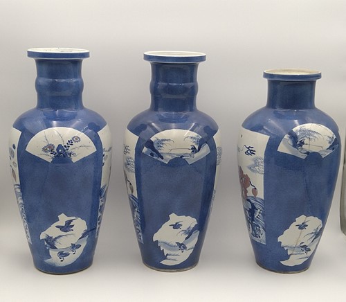Lot 28 - A garniture of three Chinese powder blue ground vases, Qing Dynasty, 18th/19th century