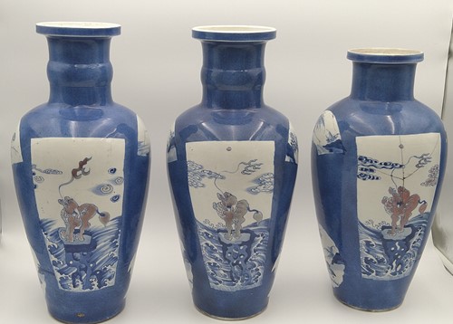 Lot 28 - A garniture of three Chinese powder blue ground vases, Qing Dynasty, 18th/19th century