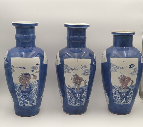 Lot 28 - A garniture of three Chinese powder blue ground vases, Qing Dynasty, 18th/19th century