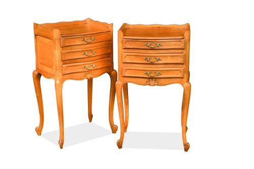 Lot 525 - A pair of vintage French provincial pale cherrywood bedside tables