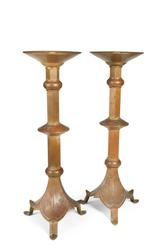 Lot 194 - A pair of patinated copper candlesticks, circa 1900