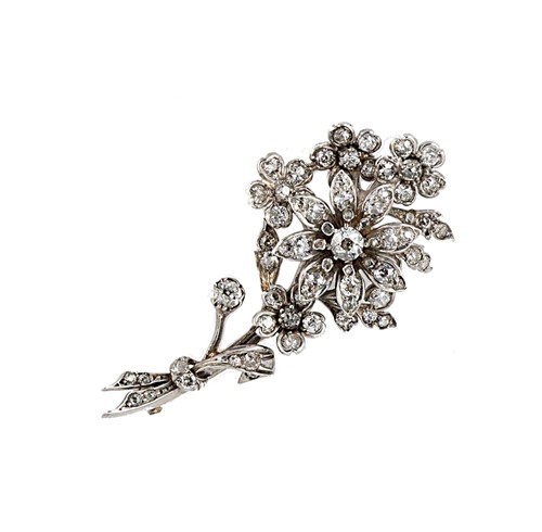 Lot 167 - A diamond set flower brooch