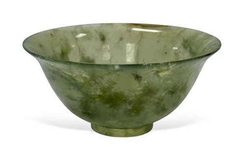 Lot 65 - A Chinese turned mottled green jade bowl, early 20th century