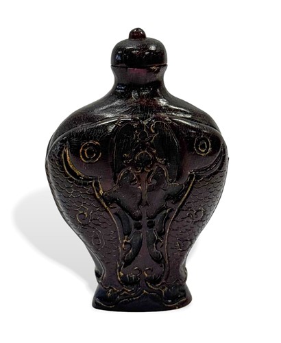 Lot 144 - A Chinese carved ox-horn carp snuff bottle, Qing Dynasty, 19th century