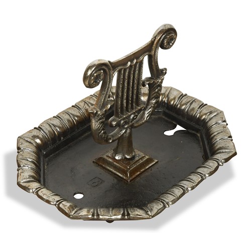 Lot 599 - A polished iron boot scraper, 19th century
