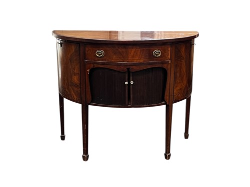 Lot 444 - A mahogany demi lune sideboard, the...