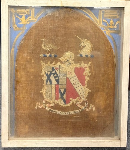 Lot 339 - A framed woolwork armorial panel, the shield...