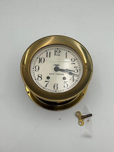 Lot 133 - A brass mounted circular Marine Bulkhead Clock...