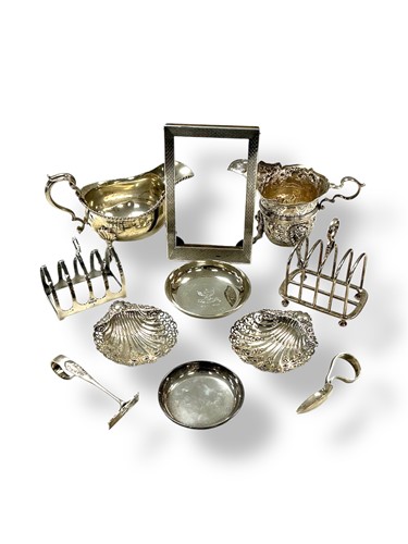 Lot 237 - A collection of silverware including toast...