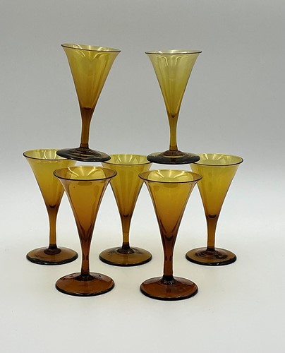 Lot 12 - Seven 19th century amber wine glasses