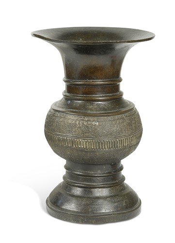Lot 33 - A Chinese patinated bronze archaic-style zun vase, Ming Dynasty