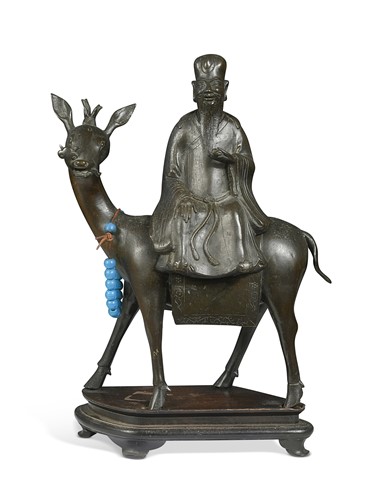 Lot 32 - A Chinese bronze censer as Shoulao riding a deer side-saddle, late Ming Dynasty