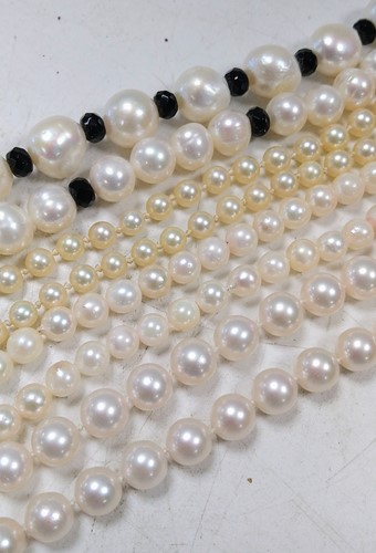 Lot 253 - Three cultured pearl necklaces, together with...