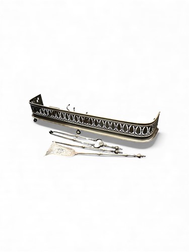 Lot 781 - Steel fender and fire irons, to include tongs,...