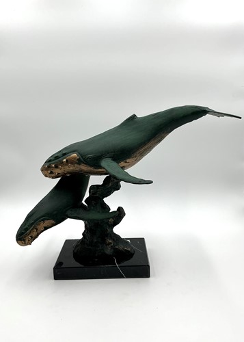 Lot 251 - A bronzed green patinated model of a pair of...
