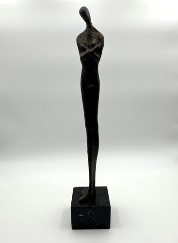 Lot 248 - A bronzed patinated sculpture of an elongated...