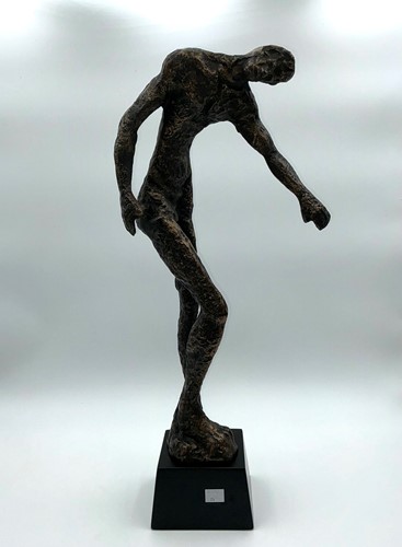 Lot 249 - A large bronzed metal sculpture of a standing...