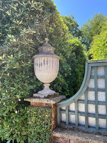 Lot 712 - A composite stone urn and cover, 20th century