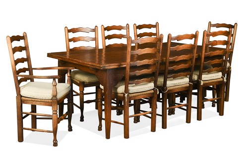 Lot 333 - A rustic oak draw-leaf dining table on tapered legs, 20th century