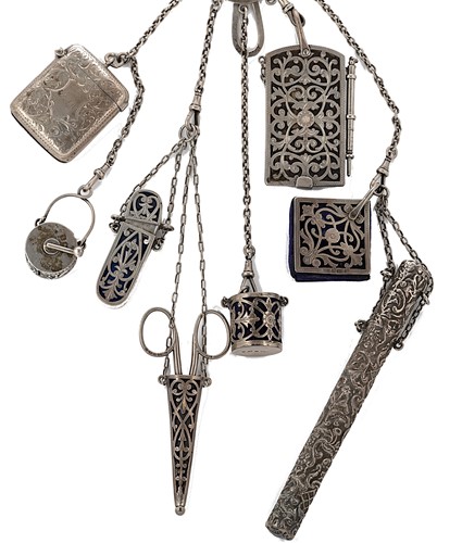 Lot 210 - A Victorian silver chatelaine with six attachments and two additions
