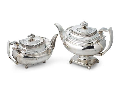 Lot 304 - Two George III silver teapots of similar appearance