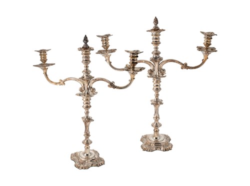 Lot 256 - A pair of silver plated metamorphic three light candelabra