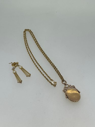 Lot 179 - A locket stamped '9.375', suspended from a...