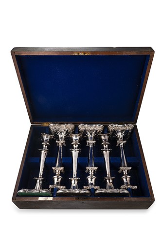 Lot 257 - A cased set of six silver plated candlesticks
