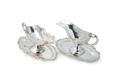 Lot 269 - Two Peruvian metalwares silver sauce boats, each with integral stands