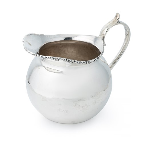 Lot 263 - A Peruvian metalwares silver water jug
