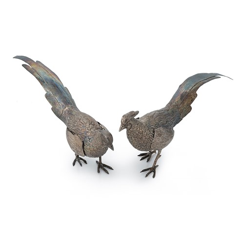 Lot 264 - A pair of Peruvian metalwares silver table ornaments modelled as pheasants