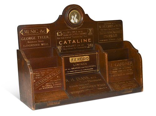 Lot 640 - A mahogany and gilt-painted Welsh advertising rack, late 19th century