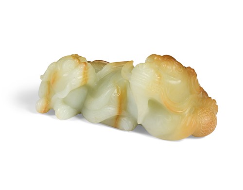 Lot 39 - A Chinese jade dog of fo and pup group, 20th century