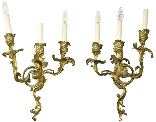 Lot 506 - A pair of Rococo style ormolu wall light brackets, early 20th century